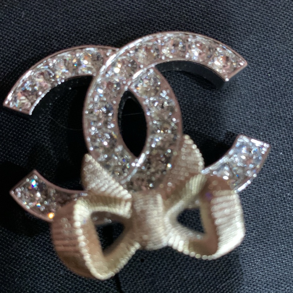 Brand new authentic CHANEL Silver and Champaign Brooch with crystals and Pouch